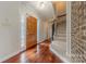 Elegant foyer featuring hardwood floors, a staircase, and a decorative front door with sidelights at 10101 Woodview Cir, Charlotte, NC 28277