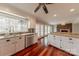 Spacious kitchen featuring stainless steel dishwasher and white cabinets, ideal for cooking and entertaining guests at 10101 Woodview Cir, Charlotte, NC 28277