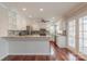 Modern kitchen featuring white cabinets, stainless appliances, granite countertops, and a stylish backsplash at 10101 Woodview Cir, Charlotte, NC 28277