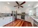 Bright kitchen with stainless steel appliances, stylish backsplash, and a large window offering natural light at 10101 Woodview Cir, Charlotte, NC 28277