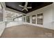 Screened porch featuring a ceiling fan and views of the yard at 10101 Woodview Cir, Charlotte, NC 28277