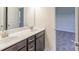 Bathroom featuring double sinks, vanity, and a view into the bedroom at 104 Kentmore Dr, Marvin, NC 28173