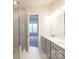 Bathroom with a double vanity, walk-in glass shower, and neutral color palette at 104 Kentmore Dr, Waxhaw, NC 28173