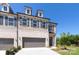 New construction townhome with a two-car garage and stone and brick facade at 104 Kentmore Dr, Waxhaw, NC 28173