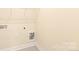 Clean and functional laundry area with tiled floor and utility connections, ready for appliances at 104 Kentmore Dr, Waxhaw, NC 28173