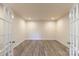 Bright office with wood flooring, white walls, and glass french doors at 104 Kentmore Dr, Waxhaw, NC 28173