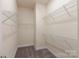 Walk-in closet with carpeted floor and wire shelving offering ample storage space at 104 Kentmore Dr, Waxhaw, NC 28173