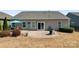 Cozy backyard featuring a brick patio and well-maintained lawn, perfect for outdoor entertaining at 11124 Chapeclane Rd, Charlotte, NC 28278