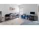 Functional bedroom with a workstation and natural light from the window at 11124 Chapeclane Rd, Charlotte, NC 28278