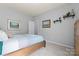 A cozy bedroom featuring neutral walls, soft carpeting, and a comfortable wooden bed at 11124 Chapeclane Rd, Charlotte, NC 28278