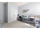 Functional bedroom featuring neutral walls and carpet, with a workspace and double door closet at 11124 Chapeclane Rd, Charlotte, NC 28278