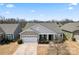 Charming single-story home with a covered front porch and a two-car garage in a desirable neighborhood at 11124 Chapeclane Rd, Charlotte, NC 28278
