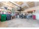 Organized garage space with ample tool storage, a bicycle, and various equipment at 11124 Chapeclane Rd, Charlotte, NC 28278