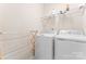 Practical laundry room with washer, dryer, and shelving for storage, paired with a convenient wooden drying rack at 11124 Chapeclane Rd, Charlotte, NC 28278