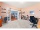 Spacious living room showcasing French doors, plush carpeting, and abundant natural light at 11124 Chapeclane Rd, Charlotte, NC 28278