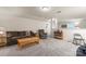 Relaxing living room with neutral carpet, a sectional sofa, and a wooden coffee table at 11124 Chapeclane Rd, Charlotte, NC 28278