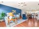 Comfortable living room with hardwood floors, a blue accent wall, and open access to the kitchen at 11124 Chapeclane Rd, Charlotte, NC 28278
