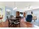 Open floor plan with hardwood floors and a dining area adjacent to a spacious living room with comfortable seating at 11124 Chapeclane Rd, Charlotte, NC 28278