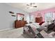 Charming bedroom with a mix of pink and gray walls, soft carpet, and decorative furniture at 11124 Chapeclane Rd, Charlotte, NC 28278