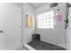 Sleek tiled shower with a glass window and a corner shelf for toiletries at 11124 Chapeclane Rd, Charlotte, NC 28278