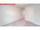 Bedroom with carpet and open doors at 11220 Cardinal Creek Ave, Charlotte, NC 28215