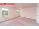 Bedroom featuring neutral carpet, natural lighting, and two windows at 11220 Cardinal Creek Ave, Charlotte, NC 28215