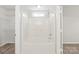 Bright bathroom features a tiled tub and shower combination with white fixtures and a window for light at 11404 Larix Dr, Charlotte, NC 28273