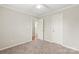 This bedroom offers neutral color palette, carpet floors, and access to an ensuite bath at 11404 Larix Dr, Charlotte, NC 28273