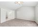 A spacious bedroom with carpet floors and a ceiling fan offers a comfortable and relaxing atmosphere at 11404 Larix Dr, Charlotte, NC 28273