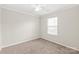 Bedroom features a window that provides natural light, carpeted floor, and white trim at 11404 Larix Dr, Charlotte, NC 28273