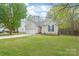 Lovely single-Gathering home showcasing a lush green lawn and an attached garage at 11404 Larix Dr, Charlotte, NC 28273