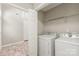 Laundry room with washer, dryer, and shelving for storage is conveniently located near bedrooms at 11404 Larix Dr, Charlotte, NC 28273