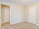 This carpeted bedroom features neutral walls, white trim, and doors, offering a blank canvas at 1212 Shenandoah Cir, Rock Hill, SC 29730