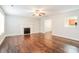 Cozy living room featuring hardwood floors, a decorative fireplace, and natural light at 1212 Shenandoah Cir, Rock Hill, SC 29730