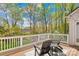 Relaxing backyard deck with furniture, overlooking a lush green yard at 12228 Plover Dr, Charlotte, NC 28269