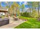 Relax on the brick patio with a hot tub and enjoy lush landscaping in the private backyard at 12228 Plover Dr, Charlotte, NC 28269