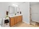 Bathroom with a double vanity, tiled floor, and a separated shower space at 12228 Plover Dr, Charlotte, NC 28269