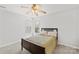 Cozy bedroom with a ceiling fan and natural light from the double windows at 12228 Plover Dr, Charlotte, NC 28269