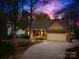 Charming single-Gathering home with a brick facade, attached garage, and well-manicured landscaping at 12228 Plover Dr, Charlotte, NC 28269