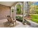 Inviting covered front porch with rocking chairs, creating a cozy and welcoming entrance at 12228 Plover Dr, Charlotte, NC 28269