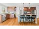 Modern kitchen with custom cabinetry, stone countertops, and stainless steel appliances at 12228 Plover Dr, Charlotte, NC 28269