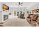 Cozy living room with fireplace, large windows, comfortable seating, and open layout at 12228 Plover Dr, Charlotte, NC 28269