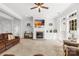 Bright living room with fireplace, TV, and large windows at 12228 Plover Dr, Charlotte, NC 28269