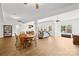 Open concept living space with dining and seating areas filled with natural light at 12228 Plover Dr, Charlotte, NC 28269