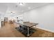 Spacious recreation room with wood flooring and a ping pong table at 12228 Plover Dr, Charlotte, NC 28269