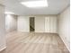 Large finished basement area providing plenty of room for storage or recreation at 1420 Hickory Nut Ln, Lincolnton, NC 28092