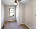 Cozy bedroom with a neutral color scheme and a window offering natural light at 1420 Hickory Nut Ln, Lincolnton, NC 28092