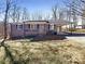 Charming brick ranch-style home featuring a covered carport and front porch, nestled on a spacious lot with mature trees at 1420 Hickory Nut Ln, Lincolnton, NC 28092