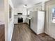 Efficient kitchen with modern appliances, ample cabinet space, and wood floors at 1420 Hickory Nut Ln, Lincolnton, NC 28092