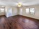 Inviting living room with wood floors, featuring a ceiling fan, and natural light at 1420 Hickory Nut Ln, Lincolnton, NC 28092